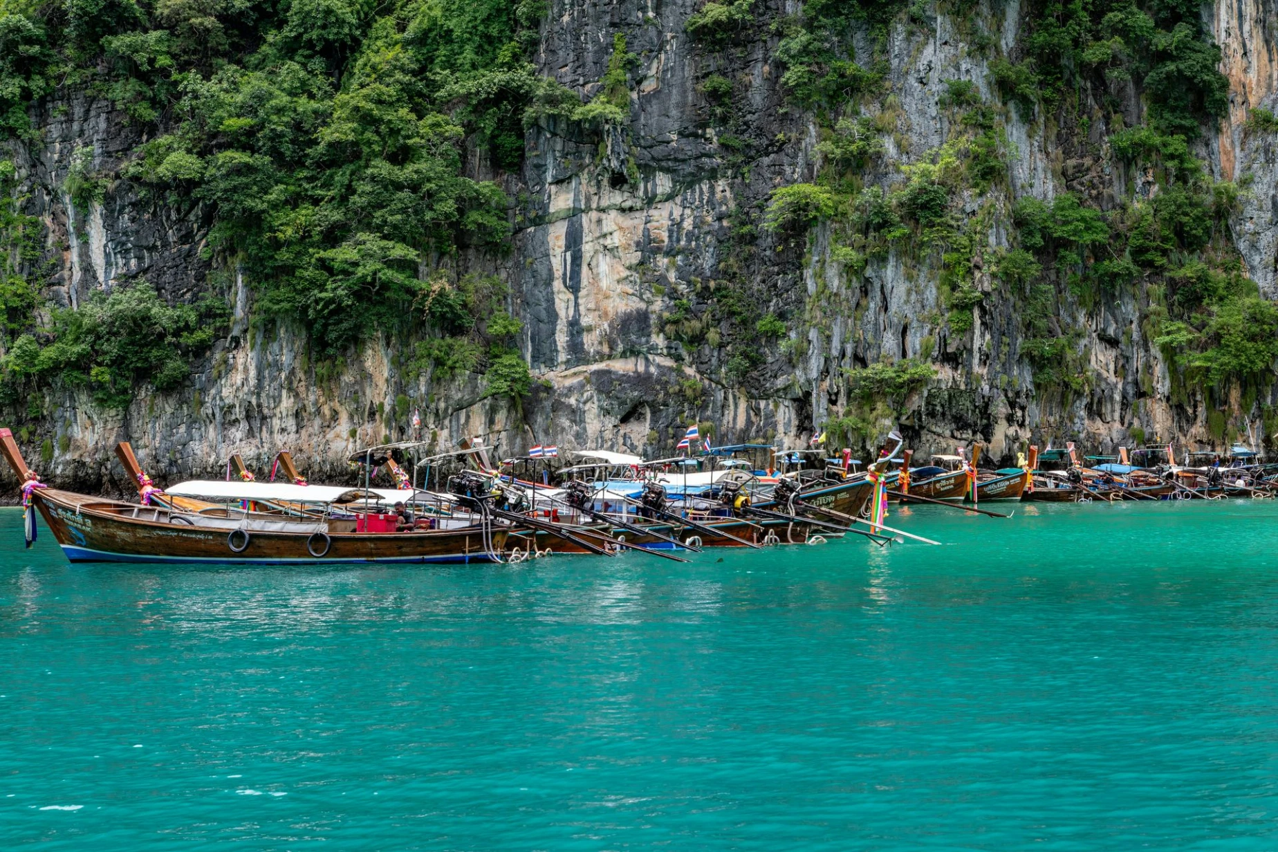 Phuket,, Thailand Boats Moored along a Tall Coastal Cliff