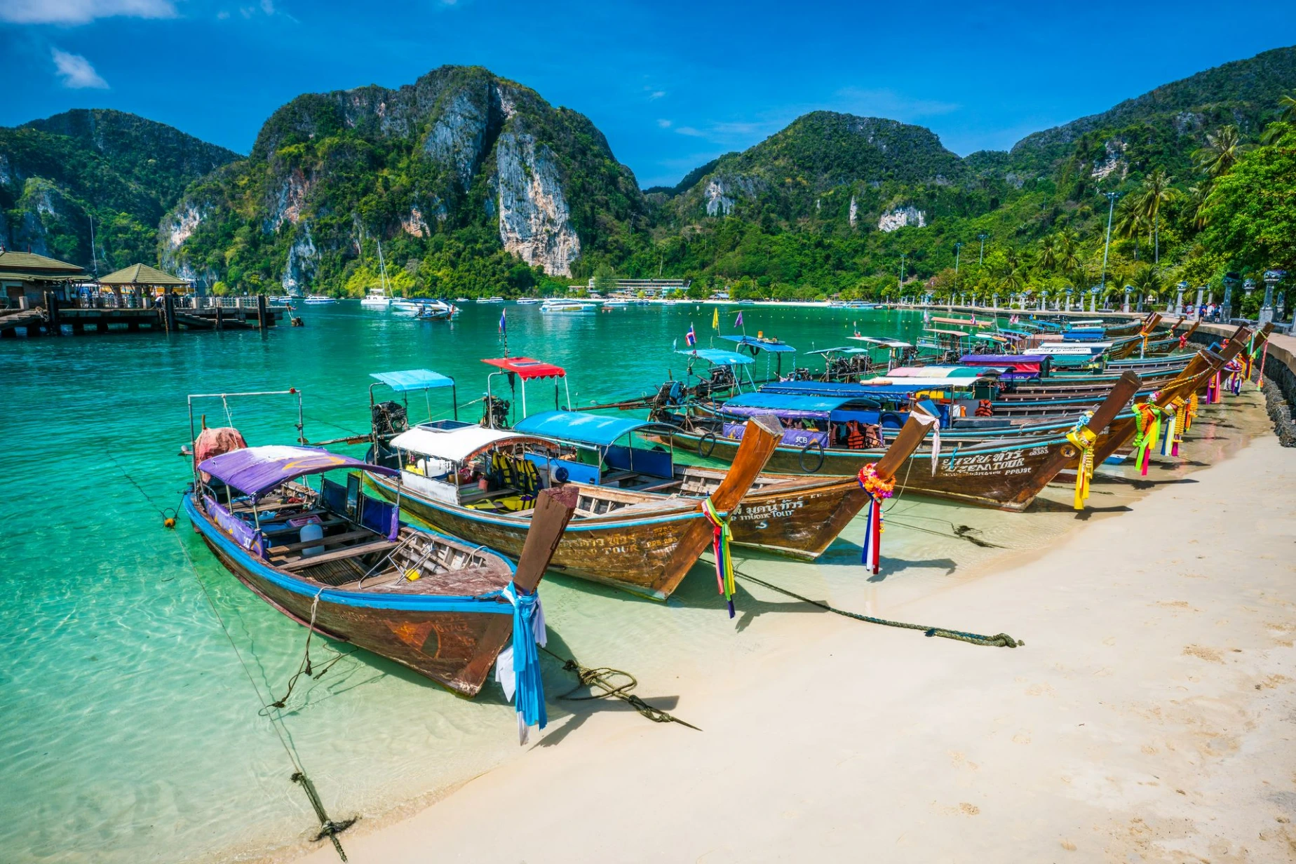 Krabi, Thailand wooden motorboat, boat trips at sea, Clean white sand beaches, and emerald green sea