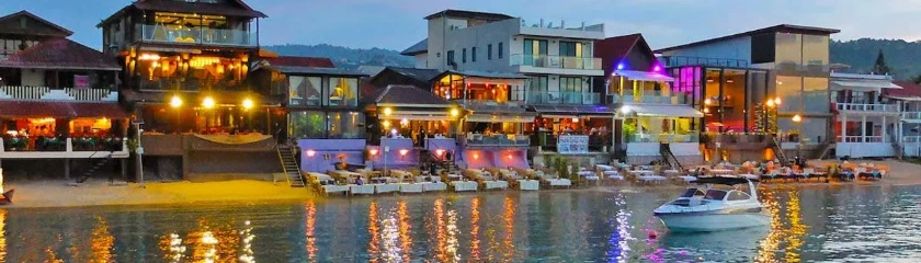 The vibrant beachfront buildings and restaurants of Fisherman's Village line the scenic shores of Bophut Beach on the northern coast of Koh Samui, Thailand.