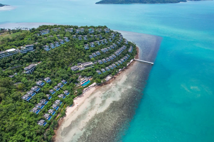 The aerial view shows the luxury hillside villas of the Conrad Koh Samui resort in Taling Ngam, Thailand, overlooking the Gulf of Thailand.
